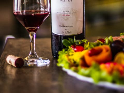 A bottle of red wine on the shelf at Monarch Liquor